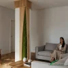 Indoor green column cover with vertical planting and modern architectural design